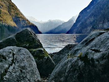 Scenic view of lake and mountains against sky