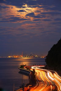 Moonlight and light trails of cars