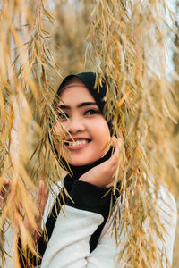 Portrait of smiling young woman outdoors