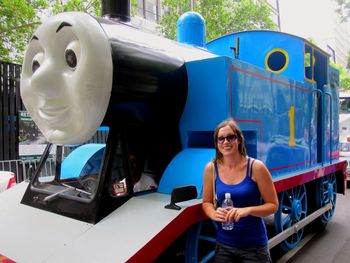 Portrait of smiling man standing in car