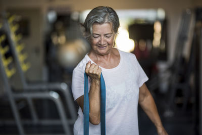 Senior woman exercising in gym