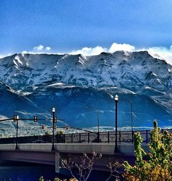 Scenic view of mountains against blue sky