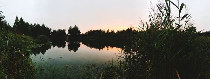 Scenic view of lake at sunset