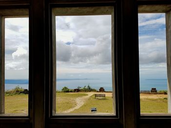 Scenic view of sea seen through window