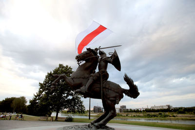 Low angle view of sculpture against sky