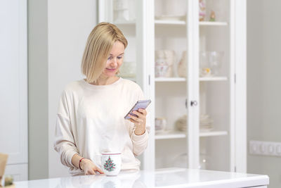 Portrait of young woman working at home