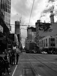 City street against cloudy sky