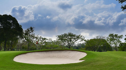 View of golf course against sky