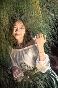 Natural beauty, portrait of smiling women happiness life with pine tree. healthy and joyful.