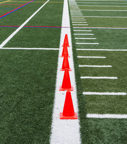 High angle view of arrow sign on field
