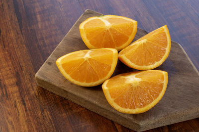 Close-up of orange fruits on cutting board