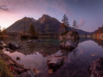 Scenic view of lake and mountains against sky