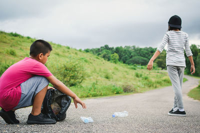 Volunteers collecting garbage on road