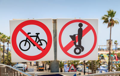 Close-up of road sign against clear sky