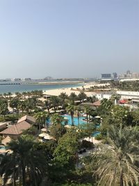 Panoramic view of sea and buildings against clear sky