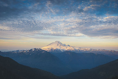 Scenic view of snowcapped mountains against sky during winter