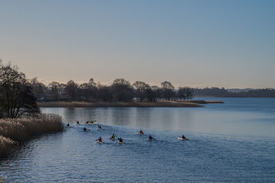 Kayakers on skanderborg lake in morning light