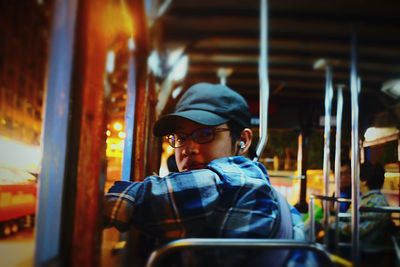 Portrait of boy looking away while sitting in bus