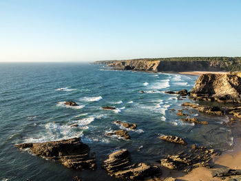 Scenic view of sea against clear sky