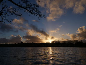 Scenic view of lake against sky during sunset