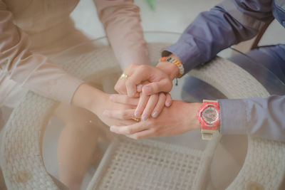 High angle view of people with hands