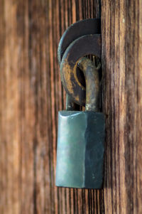 Close-up of padlock on metal door