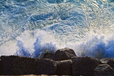 Sea waves splashing on rocks