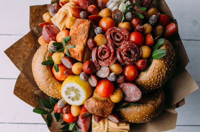 Delicious edible bouquet of sausage, tomatoes, cheese. gift for man.