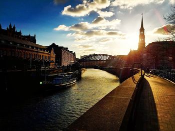 View of buildings in city at sunset