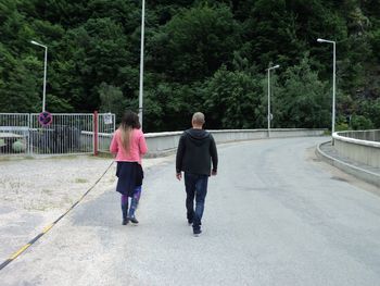 Full length of woman walking on road