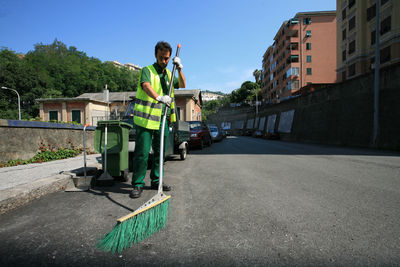 Man working on road in city