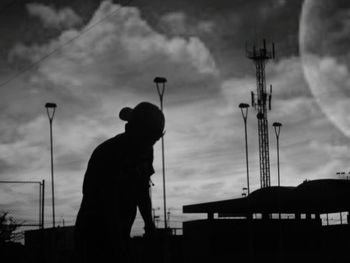 Silhouette man against sky