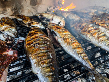 Close-up of fish on barbecue grill