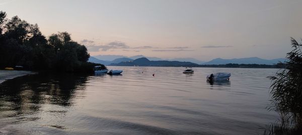 Scenic view of lake against sky during sunset