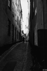 Narrow street along buildings