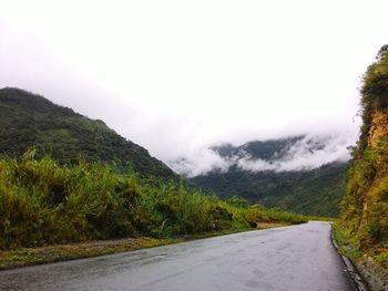 Country road leading towards mountains