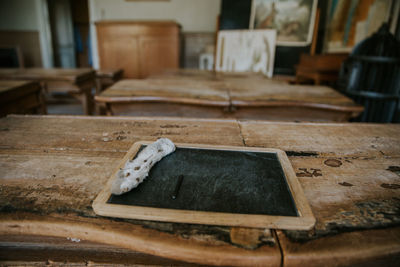 Close-up of old chair on table at home