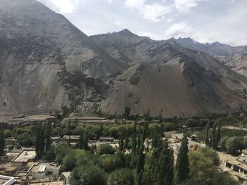 High angle view of buildings and mountains against sky