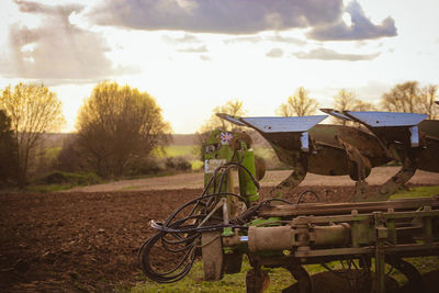 Bicycle on field against sky