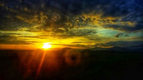 Scenic view of dramatic sky during sunset