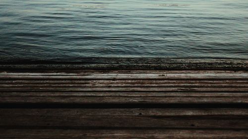 View of wooden posts in sea