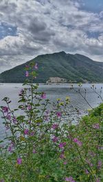 Scenic view of sea against cloudy sky