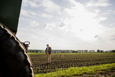 Farmer standing in a field