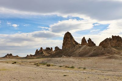 Rock formations in desert against sky