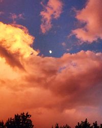 Low angle view of cloudy sky at sunset