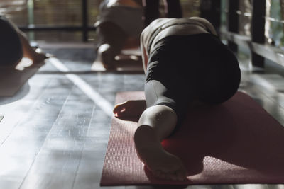 Women exercising in yoga studio