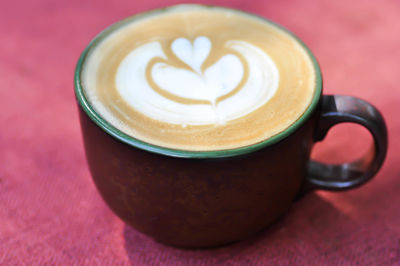 Close-up of cappuccino on table