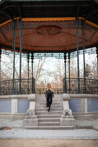 Woman standing on staircase