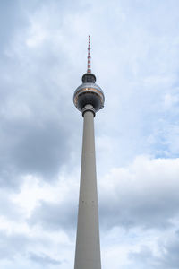 Low angle view of communications tower against sky