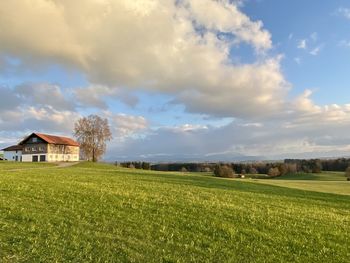 Built structure on field against sky